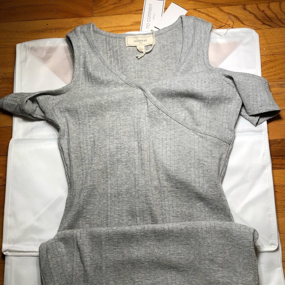 Form-fitting sweater dress. Never worn; Tags still on!